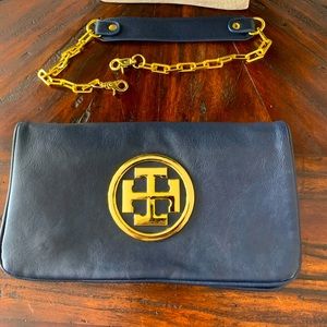 Navy purse can be clutch or shoulder bag